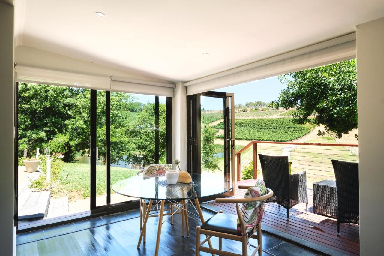 Alluvia Boutique Winery&Luxury Accommodation Stellenbosch Extérieur photo A room with a view of the vineyards